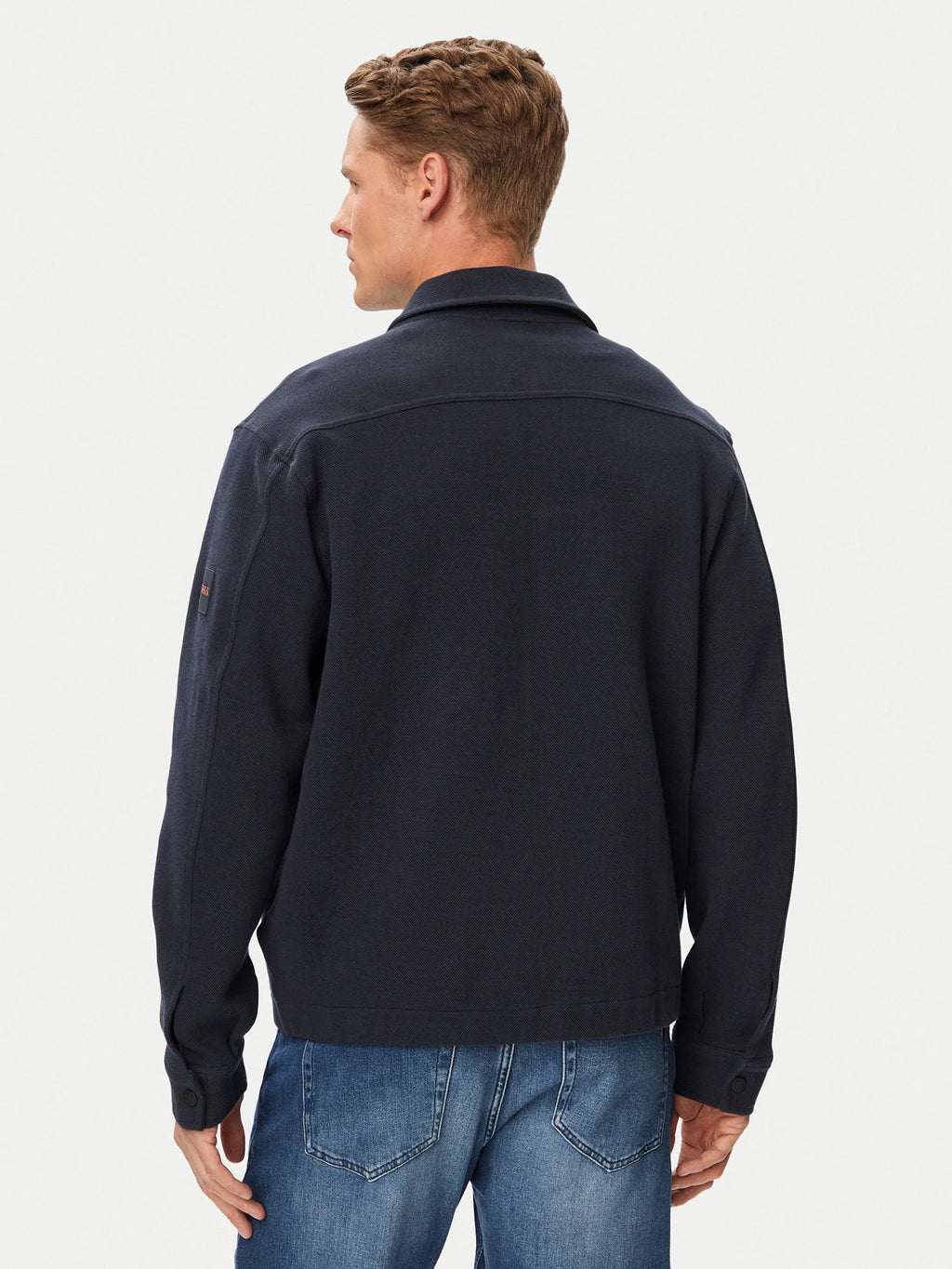 Vista traseira do casaco BOSS Ze_Bend Regular Fit azul-marinho para homem, em malha de algodão elástica, com gola clássica, corte Regular Fit e design casual premium.