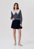 Minissaia de malha com modelagem evasê e efeito plissado FRACOMINA