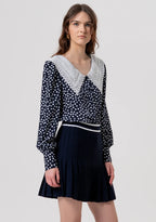 Minissaia de malha com modelagem evasê e efeito plissado FRACOMINA