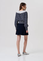 Minissaia de malha com modelagem evasê e efeito plissado FRACOMINA