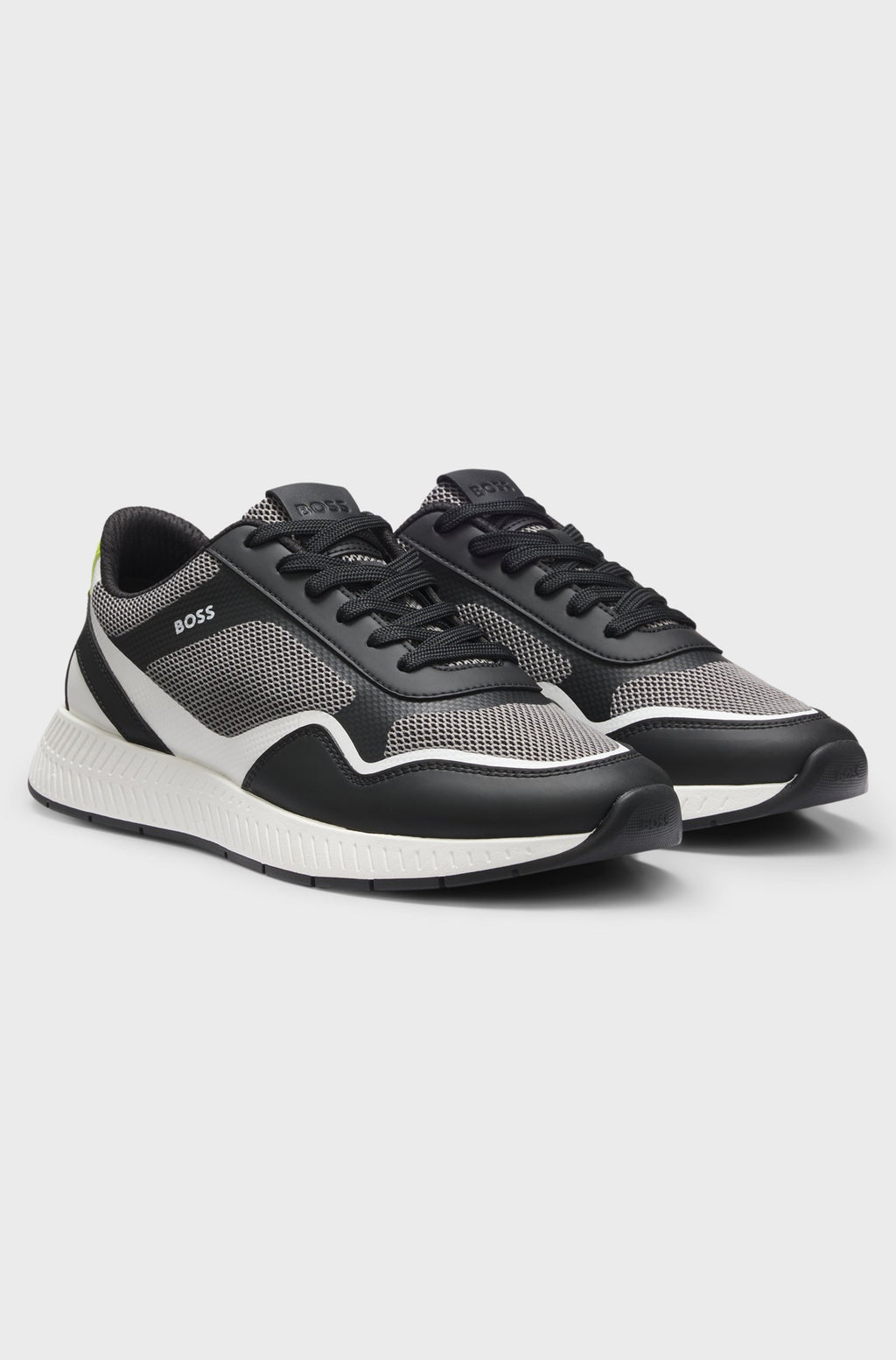 Sapatilha em tons de preto e branco com logo discreto boss para homem. 