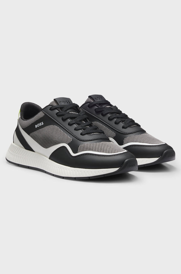 Sapatilha em tons de preto e branco com logo discreto boss para homem. 